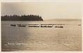 Image of Canoe parade on Tulalip Bay, circa 1912