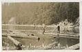 Image of Tulalip men working on a log boom, circa 1912