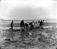 Image of Indigenous group launching their canoe at Port Townsend, August 30, 1899