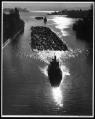 Image of Log rafts being towed through Montlake Cut, Seattle, 1955