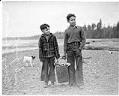 Image of Skip George and Benny Anderson carrying clams at Point Julia, February 1939