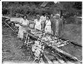 Image of Women cooking salmon, Muckleshoot Reservation, circa 1950
