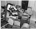 Image of Man stacking radios surrendered by Japanese Americans, Seattle, December 29, 1941