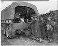 Image of Mr. and Mrs. Moji in back of military truck, March 30, 1942