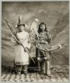 Image of Tlingit man and woman in full potlatch costumes, Alaska, 1906
