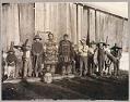 Image of Group of Chilkat people in traditional dance costumes, Klukwan, Alaska, circa 1895