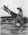 Image of Indigenous woman and canoe at the Seattle waterfront, 1898