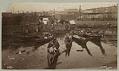 Image of Indigenous canoes docked at the Seattle waterfront, circa 1892