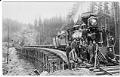 Image of Railroad construction workers and locomotive at the Green River crossing, 1885