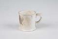 Image of White china coffee mug that burned in the Seattle Fire of 1889
