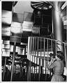 Image of Woman photographing interior of Coliseum, Seattle World's Fair, 1962