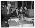 Image of Senator Warren Magnuson showing model of Science Center to federal officials, Seattle World's Fair, 1960