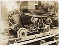 Image of Three men near concrete mixer and concrete transport car, circa 1925