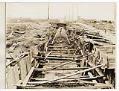 Image of Reinforced steel cable pipe frame in trench, circa 1929