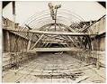 Image of Man working on reinforced steel cable pipe frame, circa 1929