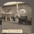 Image of Main entrance gate with car outside, looking northeast, Alaska-Yukon-Pacific Exposition, Seattle, 1909