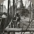 Image of Visitor at Igorrote Village at Alaska-Yukon-Pacific Exposition, Seattle, 1909