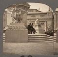Image of Two men seated at base of Alaska Monument, Alaska-Yukon-Pacific Exposition, Seattle, 1909