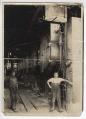 Image of Two workmen in Port Blakely Mill boiler room, circa 1900