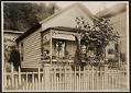 Image of Family on the porch of a mill house at Port Blakely, 1909