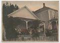 Image of Mill company house at Port Blakely with flowers on porch, circa 1900