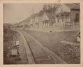 Image of Row of mill company houses in Port Blakely showing wooden tracks along road, circa 1900