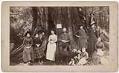 Image of Campbell and Corliss families with tree stump, 1890
