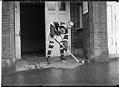 Image of Frank Foyston in hockey gear standing in doorway, Seattle, circa 1920