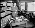 Image of Firearms and other weapons in the police department property room, circa 1922