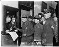 Image of Seattle General Strike deputies receiving weapons, February 6, 1919