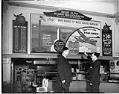 Image of War bond sign at Home of the Green Apple Pie, Seattle, 1945