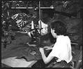 Image of Woman sewing in garment factory, Seattle, 1954