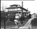Image of Boy on post in front of house in Madrona neighborhood, Seattle, circa 1924