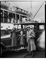 Image of Roald Amundsen with Chukchi girls on waterfront, Seattle, 1921