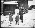 Image of Children and their champion snowman, November 20, 1921