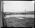 Image of Log rafts near the Ballard Bridge, circa 1919