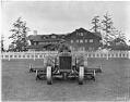Image of Man mowing lawn at Seattle Golf Club,  The Highlands, circa 1922