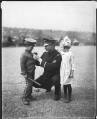 Image of Police captain Kimball with two John Muir School students, Seattle, circa 1922