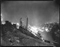 Image of Man with bucket at forest fire, circa 1926