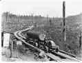 Image of Kelly-Springfield truck hauling logs, circa 1925