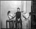 Image of Jack Hennessey with his roosters, Seattle, January 3, 1928