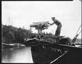 Image of Man with harpoon cannon, Bellevue, circa 1925