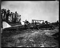 Image of Truck towing crashed plane, June 24, 1929