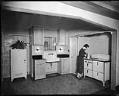 Image of Woman in kitchen at the Seattle Gas Company's model kitchen, April 29, 1932