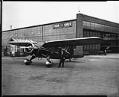 Image of Airplane near hangar, 1935