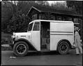 Image of Milkman with Kenworth delivery truck, probably in Seattle, 1932