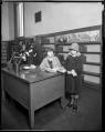 Image of Librarian and child at Seattle Public Library's University Branch, circa 1925