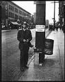 Image of Streetcar employee selling tokens, Seattle, circa 1925