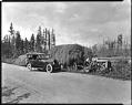 Image of Car near tractor with load of hay, 1921