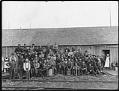 Image of Loggers outside bunkhouse, circa 1911